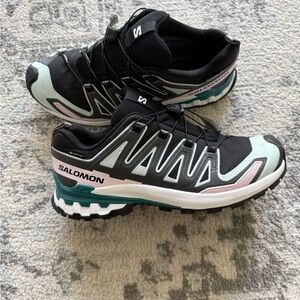Salomon Women's Trail Runners in Black, Mint, Teal, and Pink
